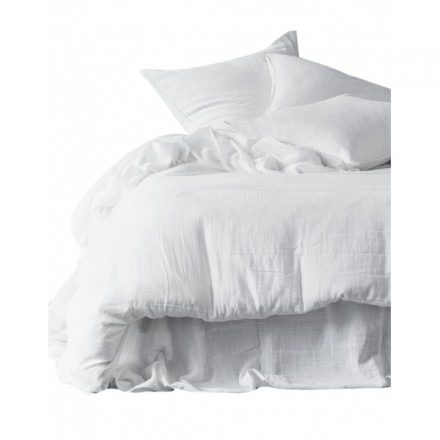 Linge de lit blanc froissé, couette et taies